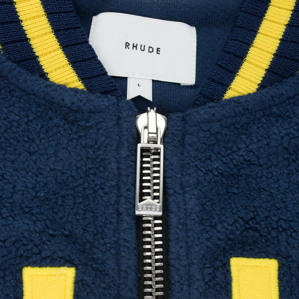 NAVY OVERSIZED LOGO TERRY VARSITY JACKET
